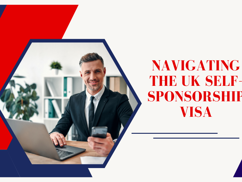 A professional businessman in a suit, smiling while working on his laptop and holding a smartphone, representing entrepreneurship and the UK self-sponsorship visa process.